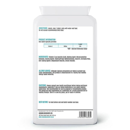 Back view of a supplement bottle with text and labels on a white background